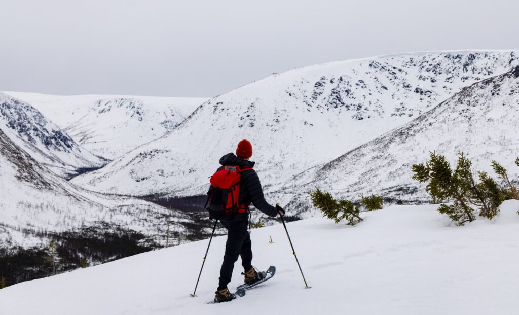 a hiker snowshoes on mont olivine in the chic choc mountains of gaspesie national park