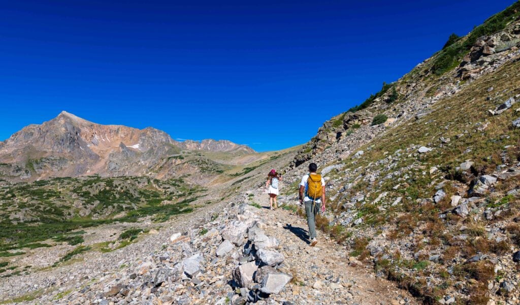 hikers on the trail near arapaho pass in colorado