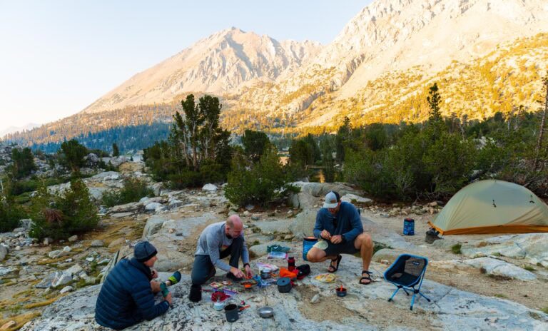 three men use their camping cook ware in the backcountry of kings canyon national park