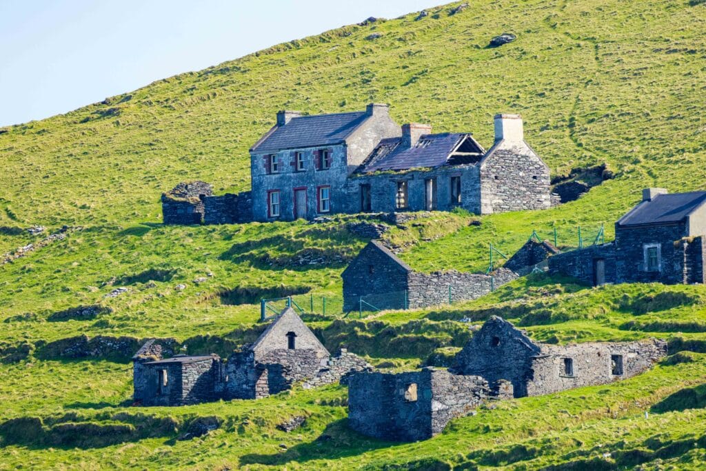 old stone house, abandoned, on the side of a hill in ireland