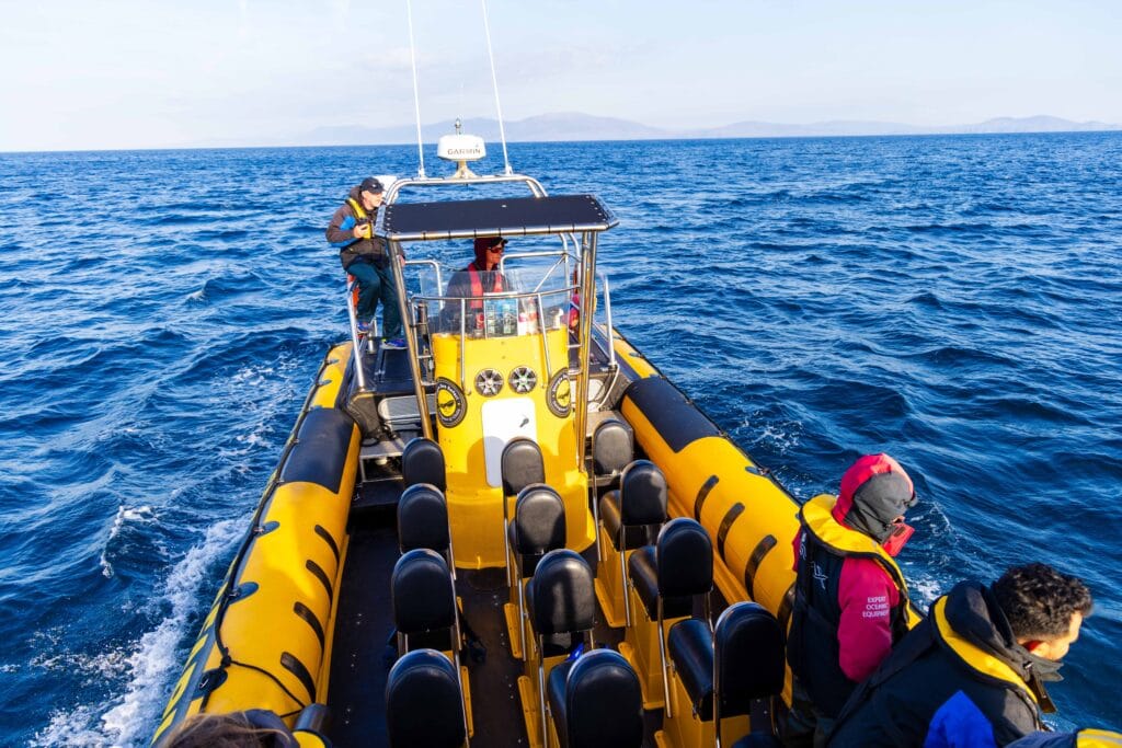 our yellow sea safari rib boat floating in the ocean off the coast of ireland