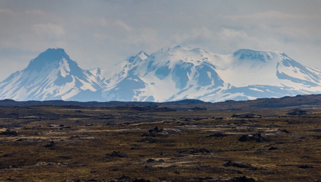 a far off glacier with nothing but dirt for miles and miles