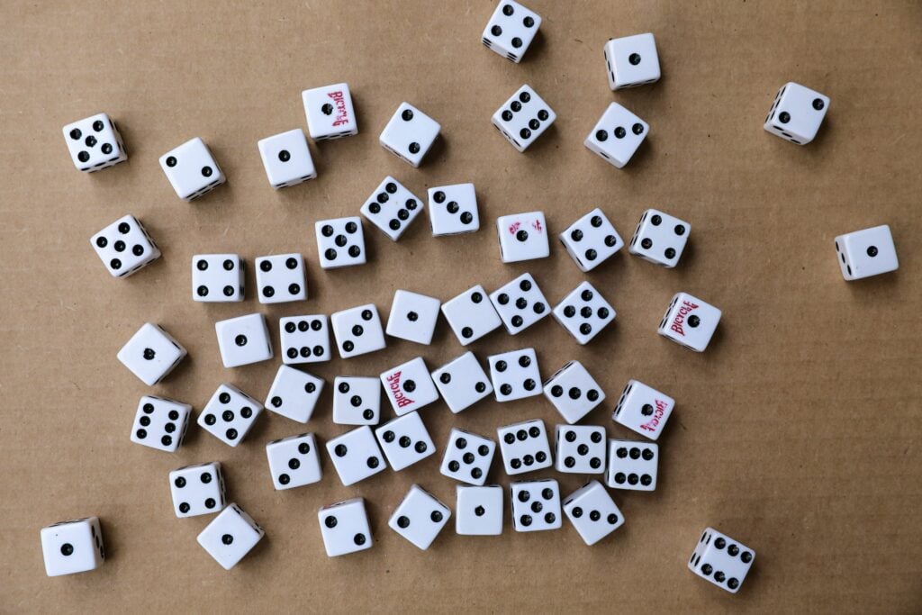 a few dozen dice on a table