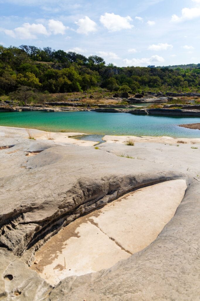 an dried up rock basin at pedernales falls state park