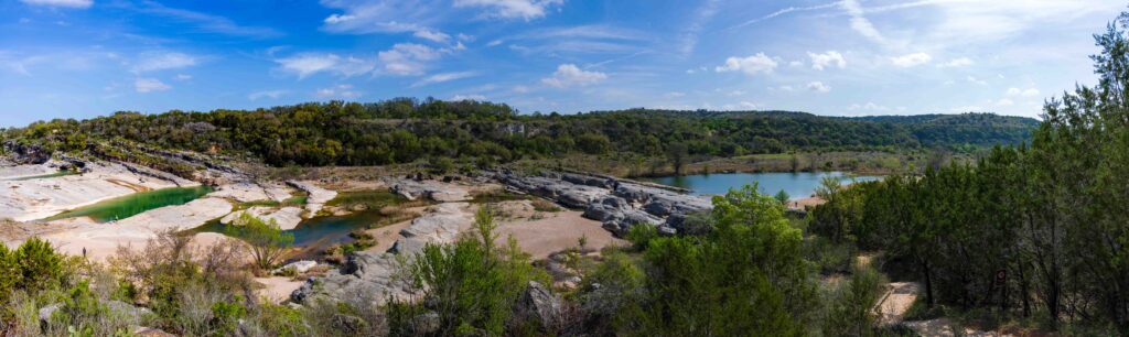 panorama photo of pedernales state park show multiple pools of water