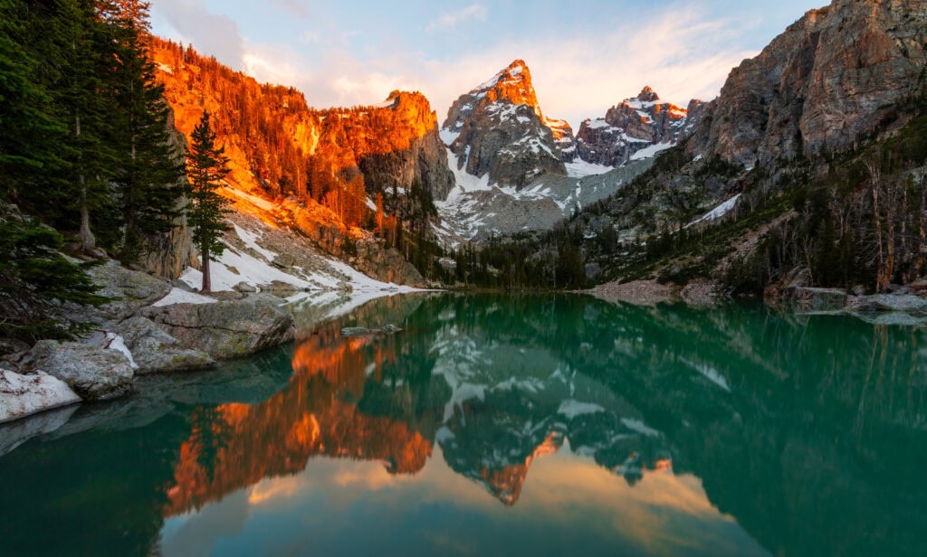 Warm orange and red canyon walls at delta lake