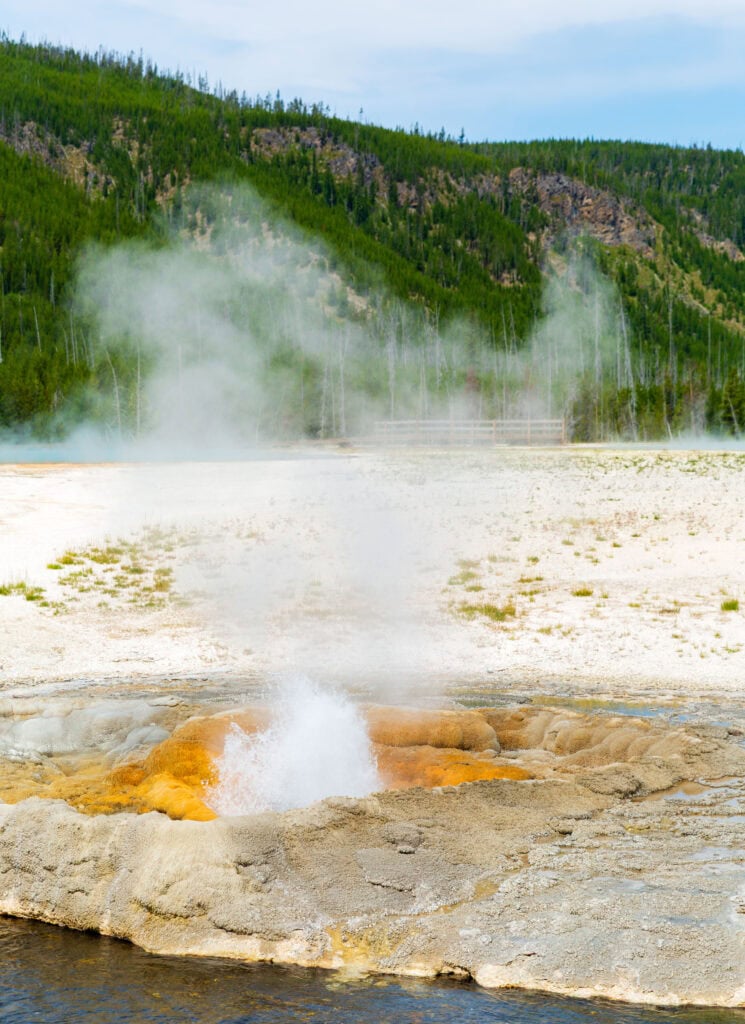 a mud pot shooting water into the air