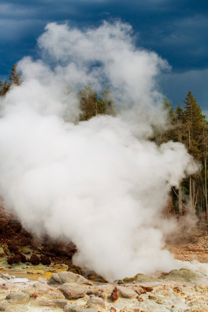 Steam cloud from Old Faithful or similar geyser eruption