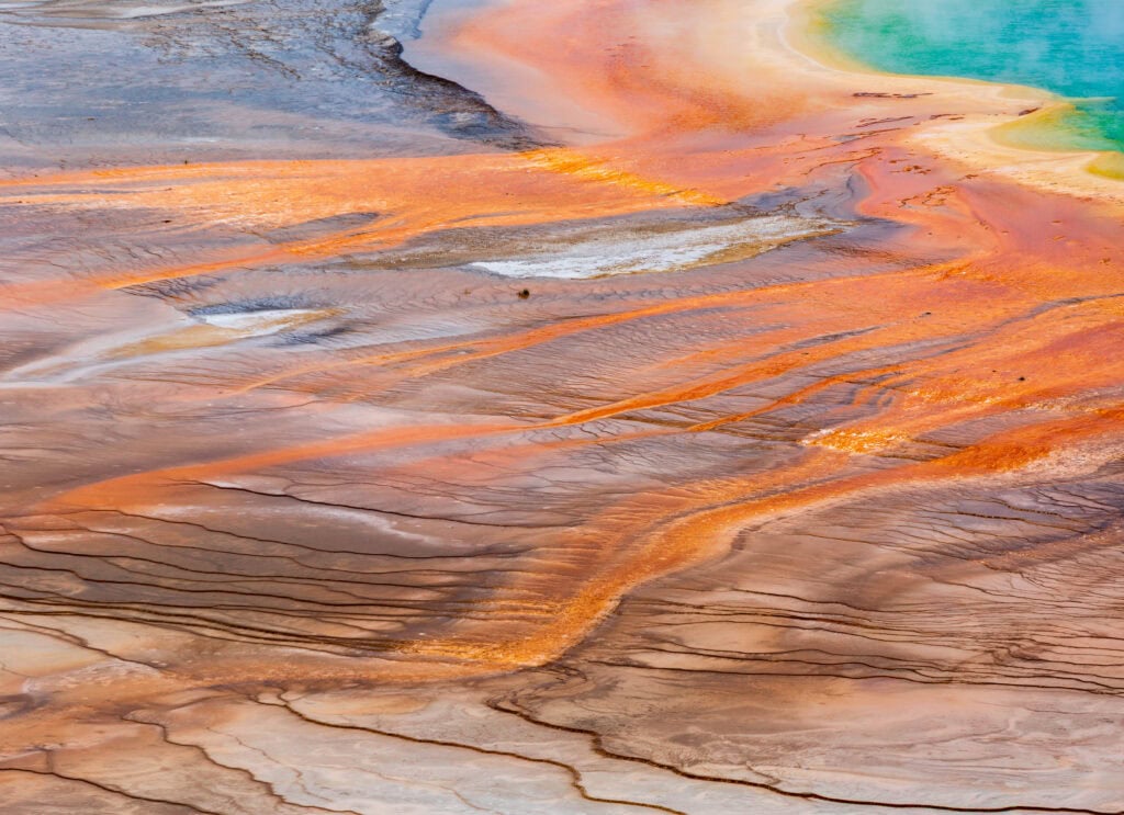view of Grand Prismatic Spring's orange and yellow bacterial mats