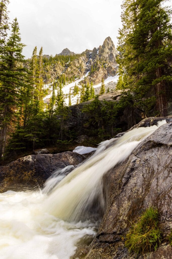 the middle portion of willow creek falls with buffalo mountain in the distance