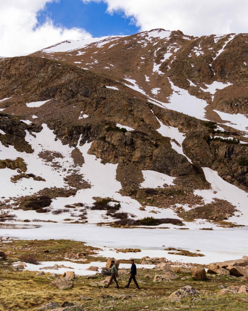 Close-up of a rugged mountainside with scattered snow patches on Herman Gulch Trail