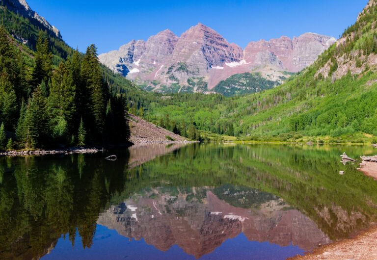a reflection off of maroon lake in aspen