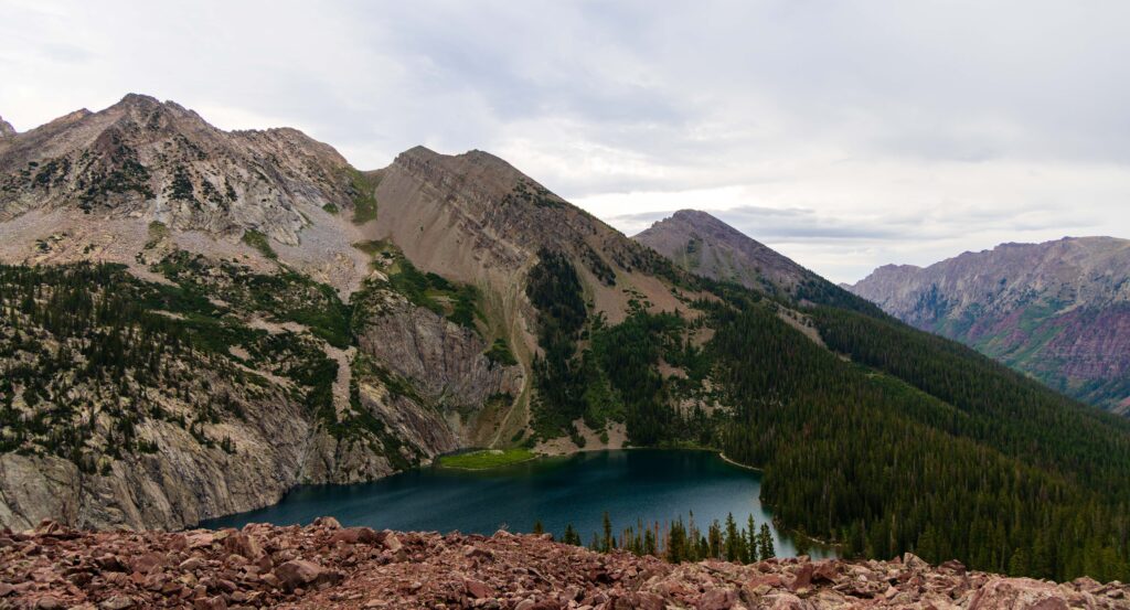 alpine lake in colorado with cloudy skies