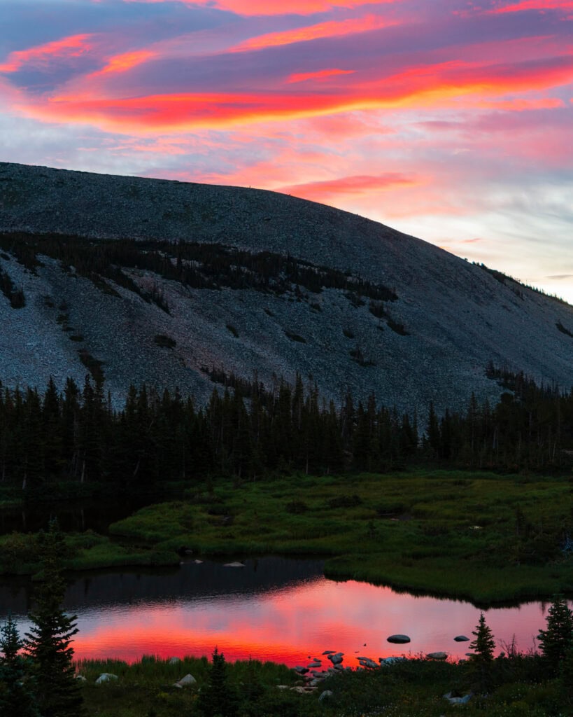 colorful sunrise reflecting off a lake