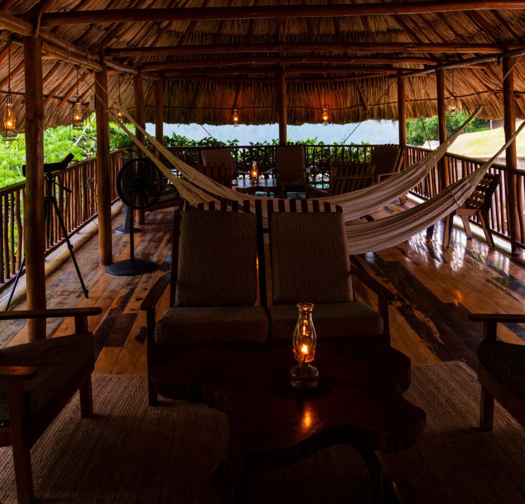 a woman sips on wine in belize at jade jungle resort
