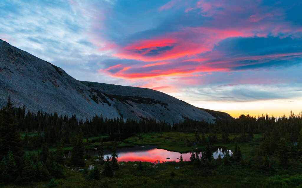 colorful sunrise reflecting off a lake