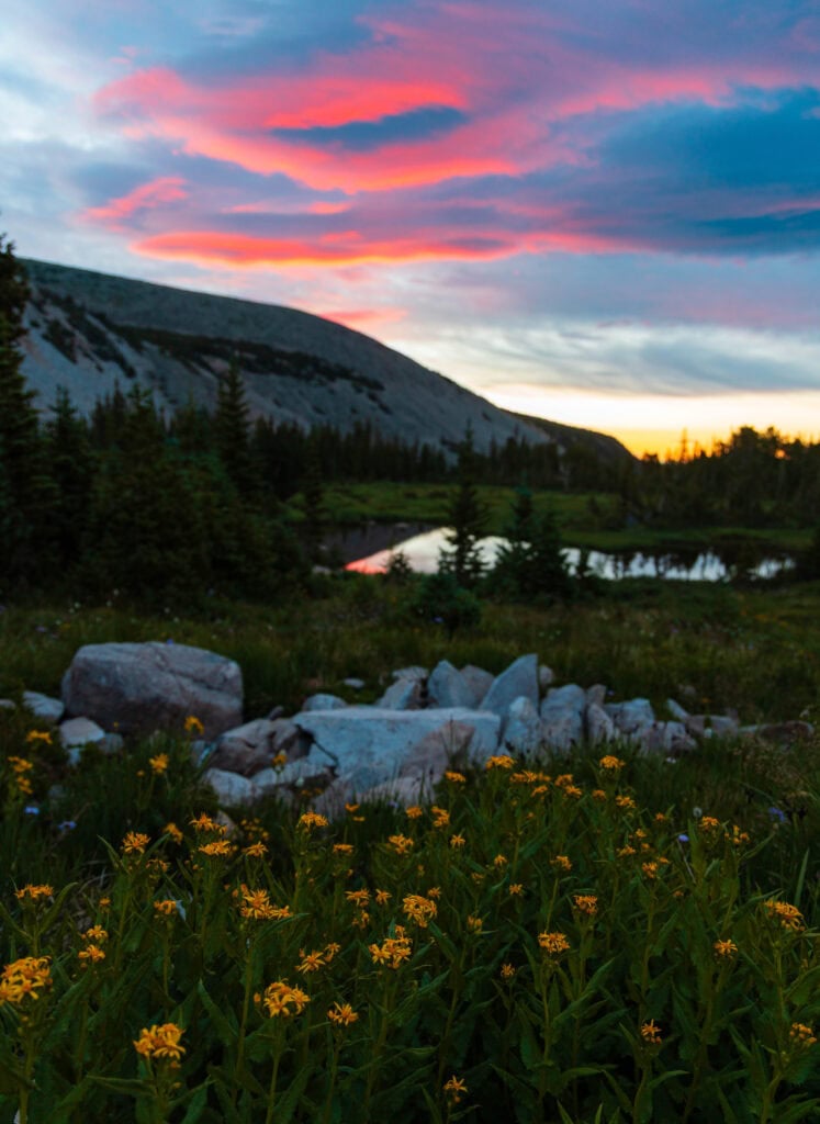 colorful sunrise reflecting off a lake