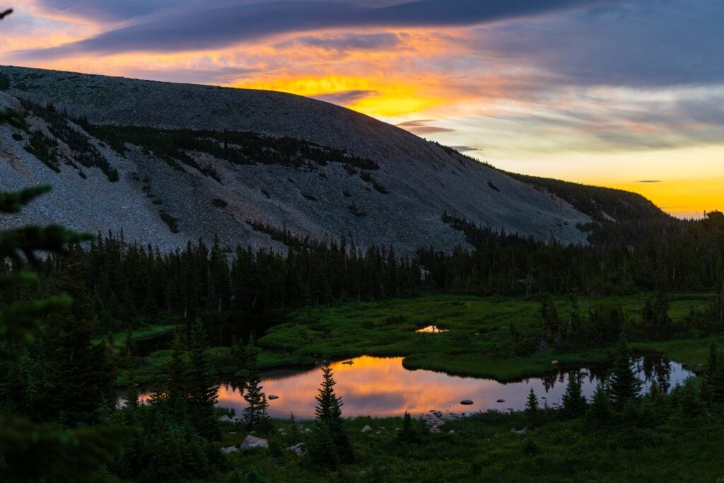 colorful sunrise reflecting off a lake