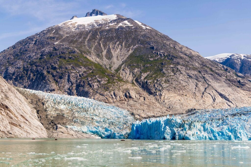 wide angle photo of the dawes glacier with a huge mountain behind it