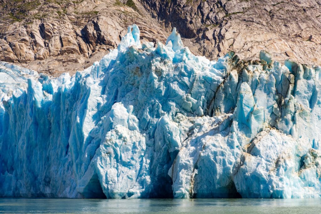 the blue ice of the dawes glacer in alaska
