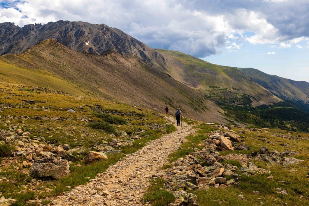 hikes making their way down from arapaho pass in colorado