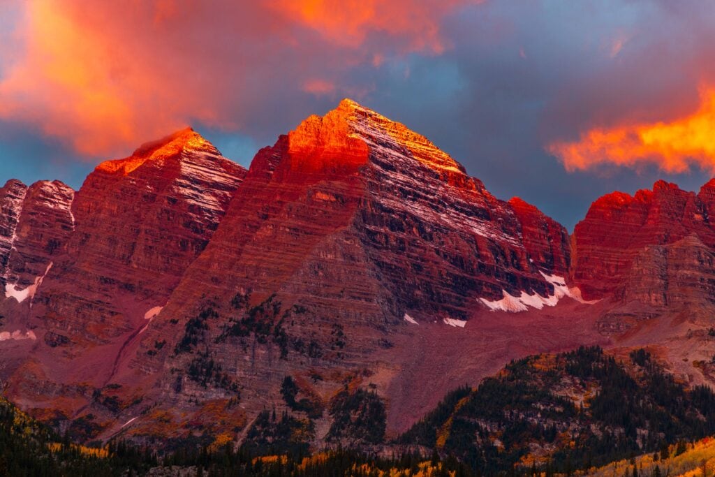 morning light hitting maroon bells in aspen colorado during fall