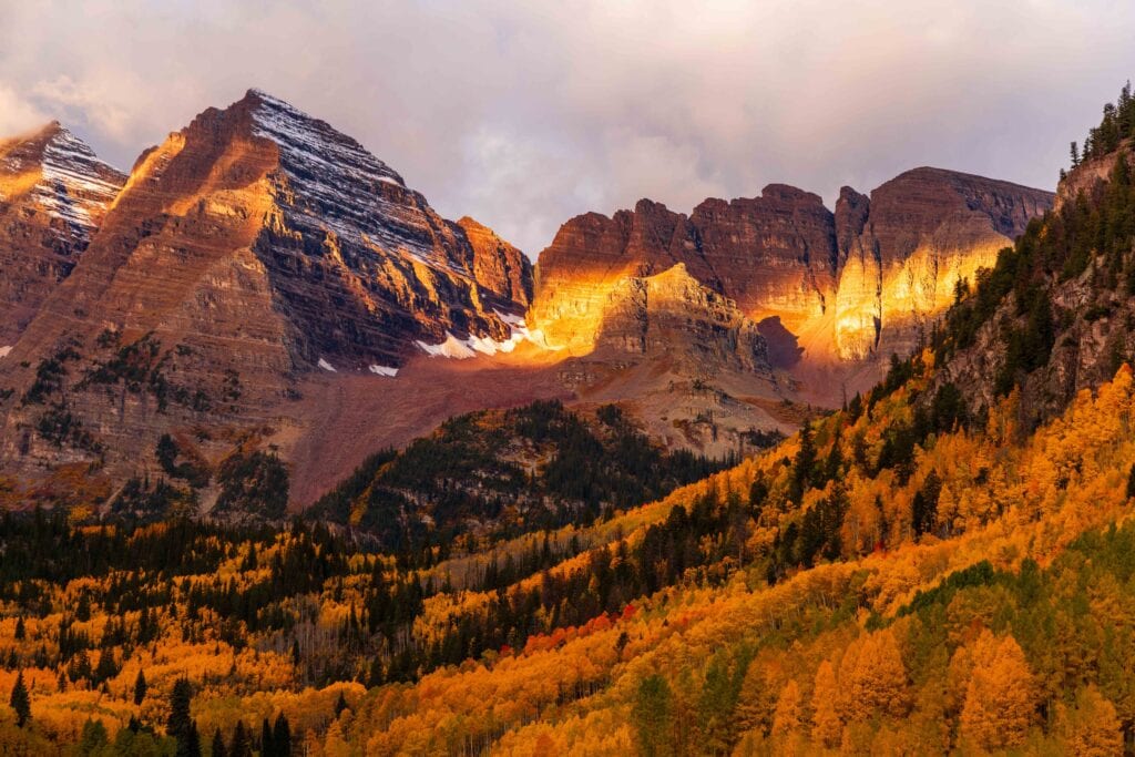 morning light hitting maroon bells in aspen colorado during fall