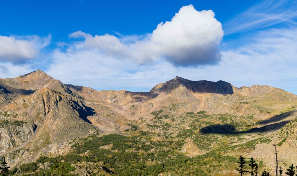 a big puffy cloud above a peak near dorothy lake