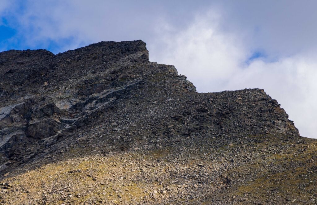 theboulder field as seen from below iwth people on it