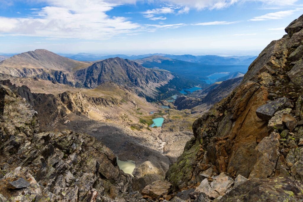 turquoise lakes in the basin far below