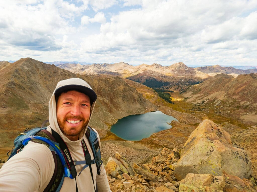 the author smiling above lost man lake in colorado