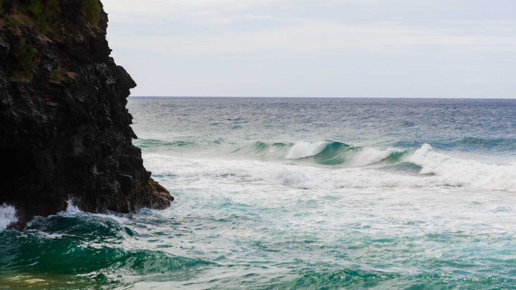 the ocean and rocks seen from Hanakapi'ai Beach