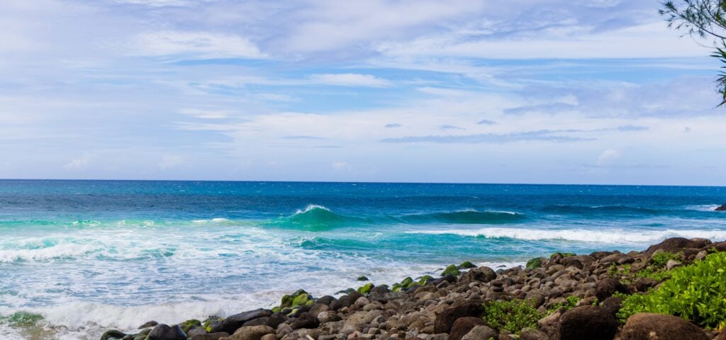 the ocean and rocks seen from Hanakapi'ai Beach
