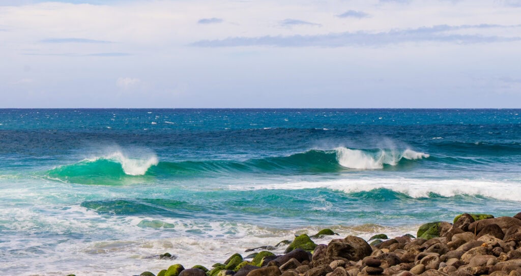 the ocean and rocks seen from Hanakapi'ai Beach