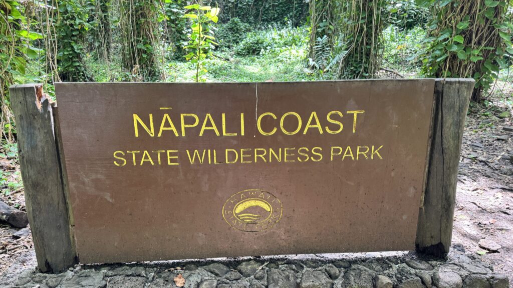 a photo of a big sign that says "napali coat state wilderness park"