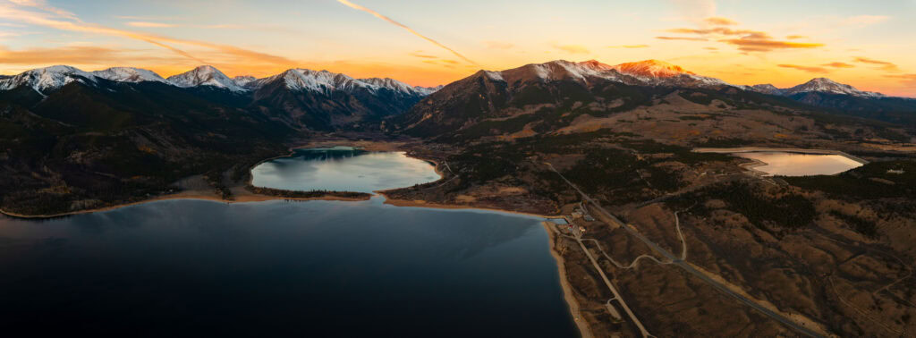 sunrise from above twin lakes in colorado with snow capped peaks
