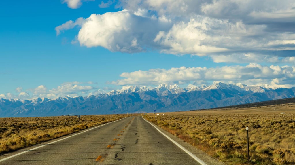 a road heading towards great sand dunes national park in colorado