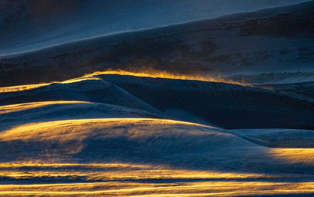 sand blowing with golden light
