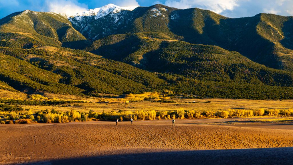 snow capped peaks near great sand dunes national park