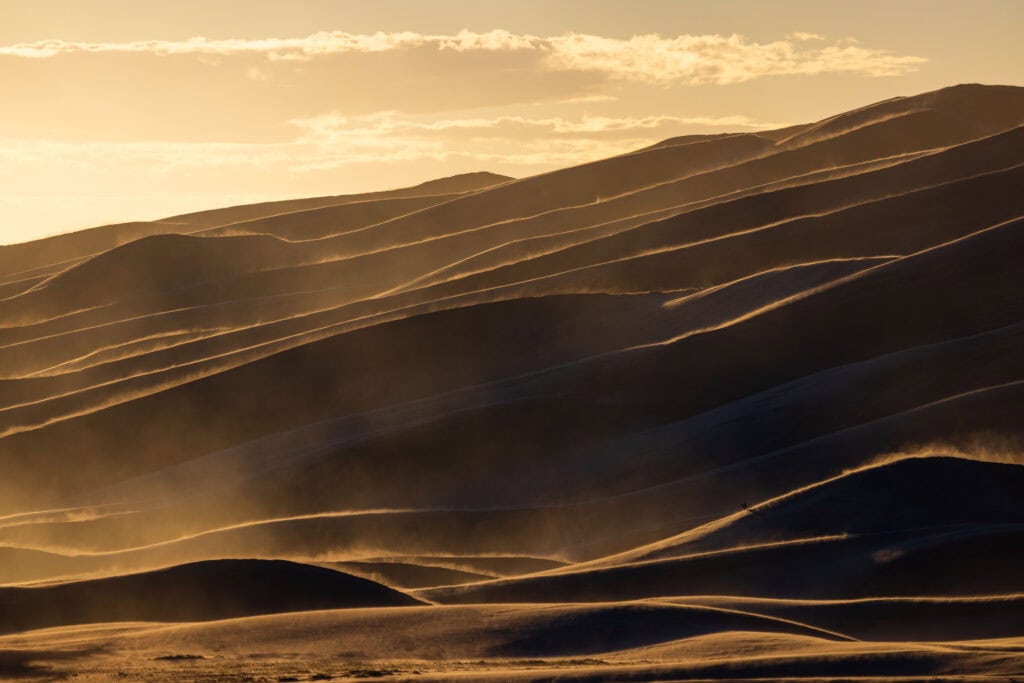 a windy sunset at great sand dunes national park