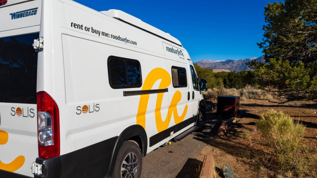 a roadsurfer van at a campground