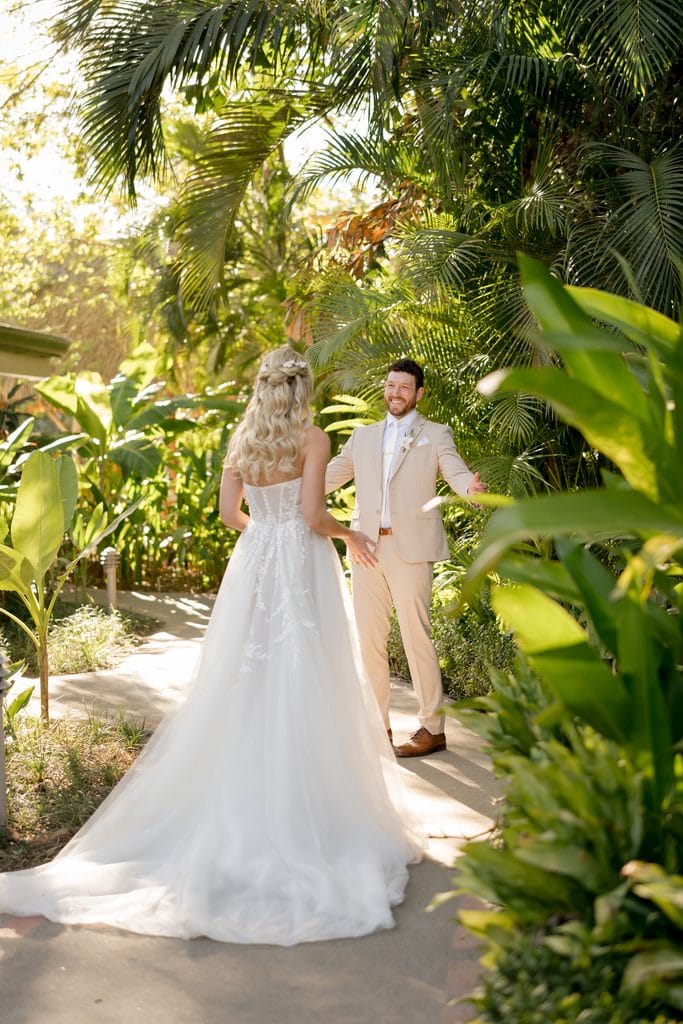 a man and wife during their first look during the costa rican destination wedding