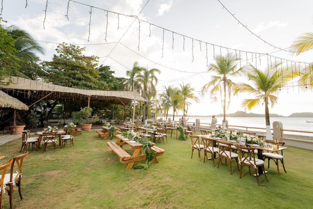 the wedding reception with tables and chairs at bahia del sol resort in costa rica